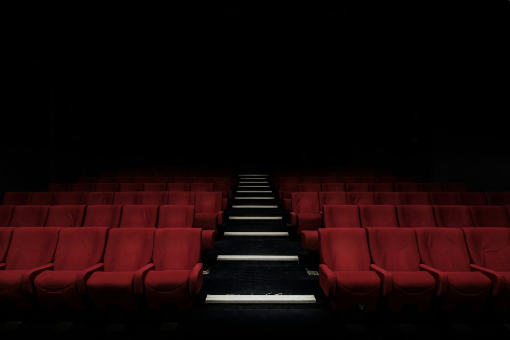 Empty cinema with red seats