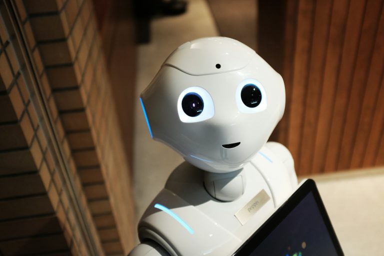 White humanoid robot looking ahead