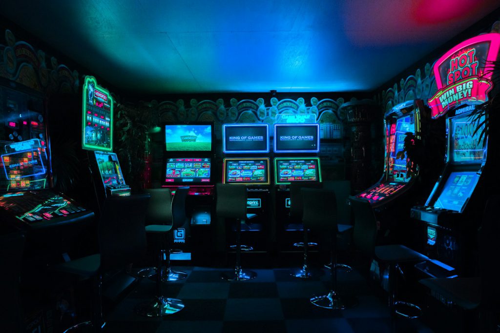 Gamer playing under neon light