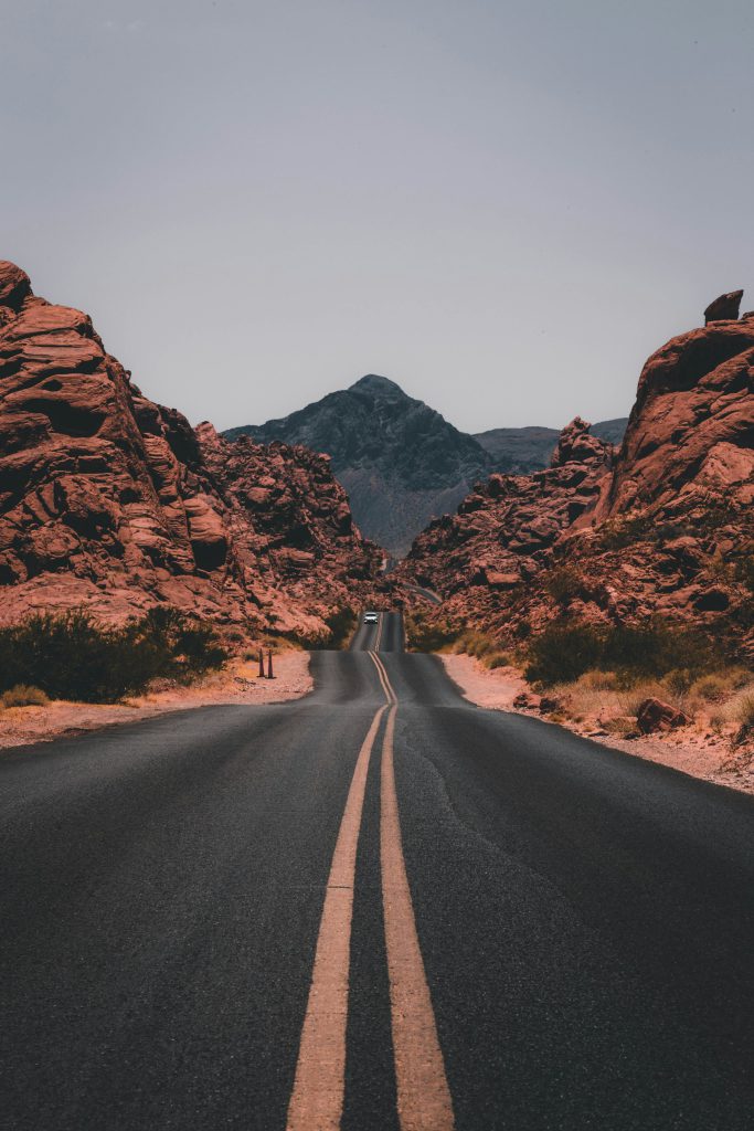 Winding road through green hills