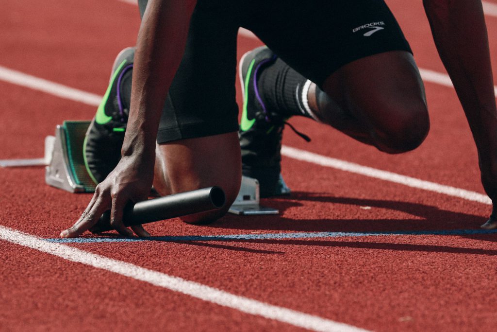 Runners on a track at speed