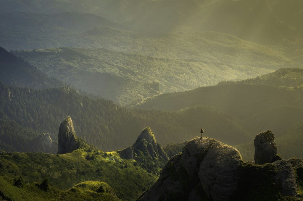 Sun rising over misty hills