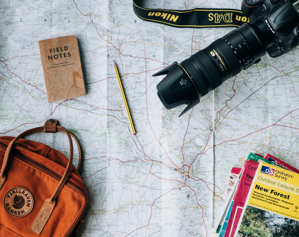 Traveller planning a route on a map